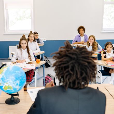 Students in a classroom with their teacher, photo by Yan Krukau on Pexels