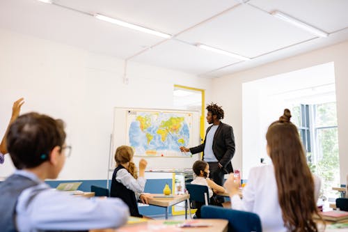 Free Teacher and Children in the Classroom Stock Photo