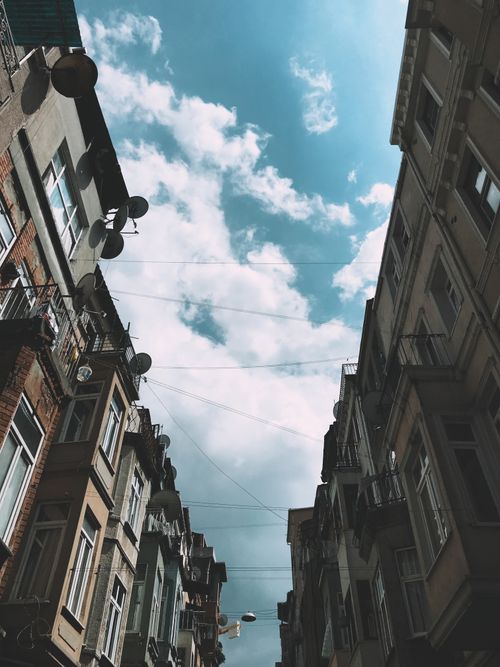 Free Low angle view of Beyoğlu's architectural buildings against a cloudy sky in Istanbul, Turkey. Stock Photo