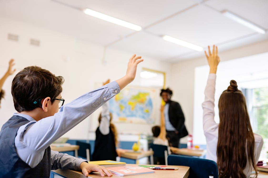 Students raising Hands