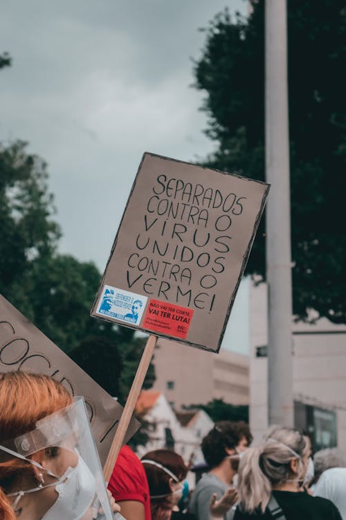 Person Holding a Placard