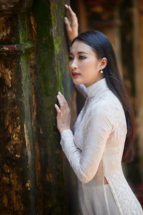 Free Beautiful Woman Holding on a Wall Stock Photo