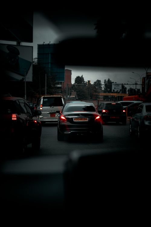 Free Traffic congestion in Nairobi with cars on a dark, busy street during dusk. Stock Photo