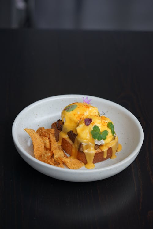 Food in a White Ceramic Plate on a Black Surface