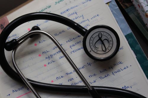 Free Black and Silver Stethoscope on White Paper Stock Photo