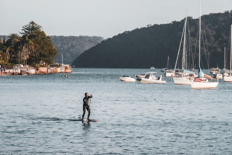 Man Using A Paddle Board In The Sea