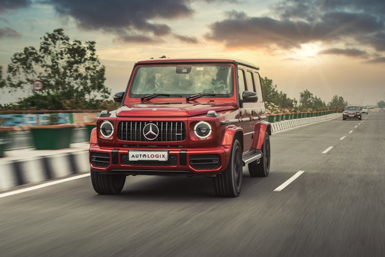 Red Mercedes Benz G Class On Road