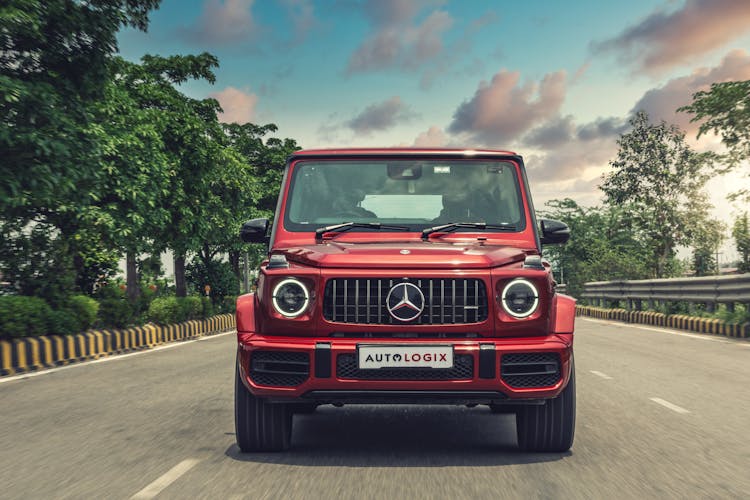 Red Mercedes Benz Car On Road