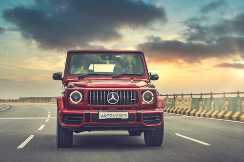 Red Mercedes Benz Car on Road