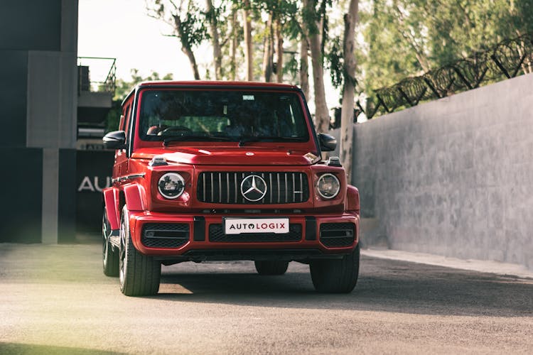 Red Crossroad Mercedes Standing At Building