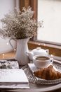 White Ceramic Teapot Beside White Ceramic Teacup on Saucer