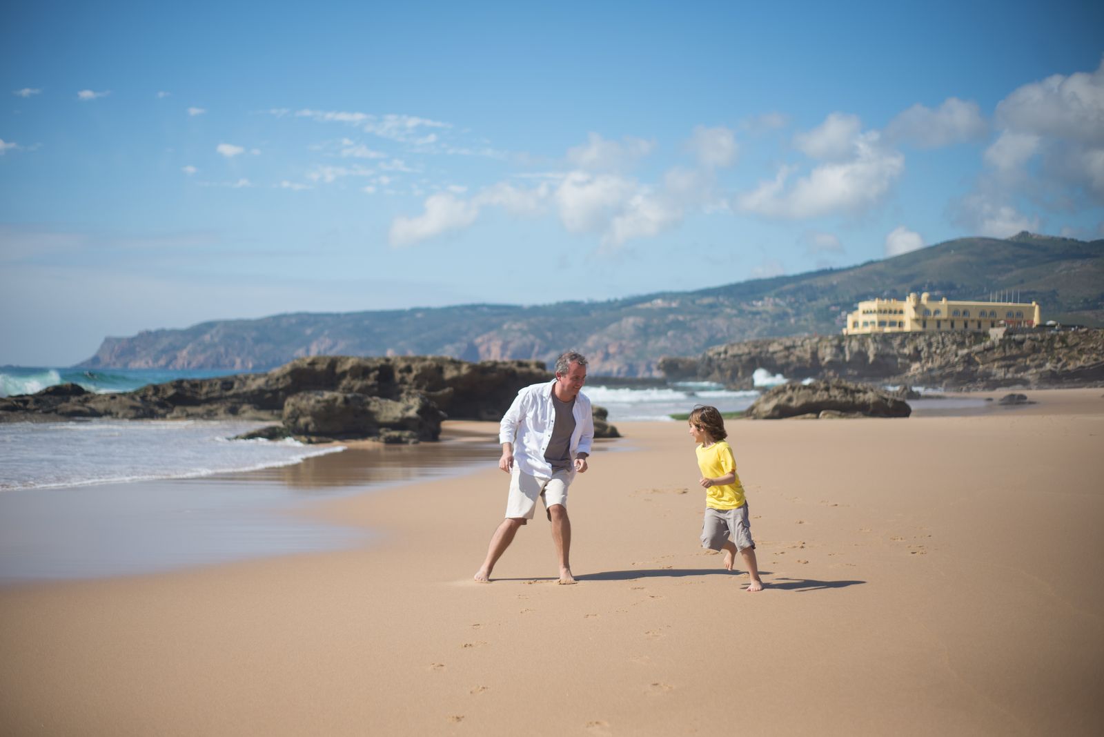 A father and son bonding together at the beach
