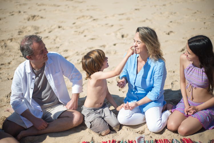 A Happy Family Spending Time At The Beach