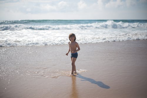 Free A Young Boy on the Beach Stock Photo