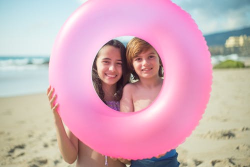 Teenage Girl and a Boy Holding a Floater