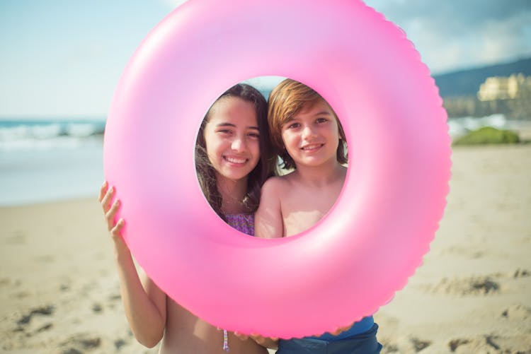 Teenage Girl And A Boy Holding A Floater