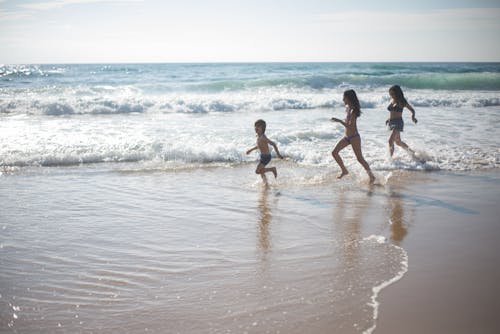 People Running on the Beach