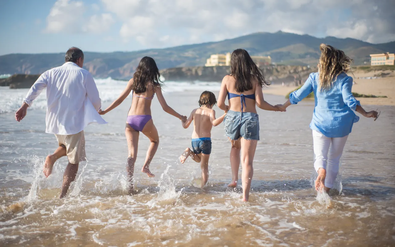 A family enjoying a sunny beach holiday