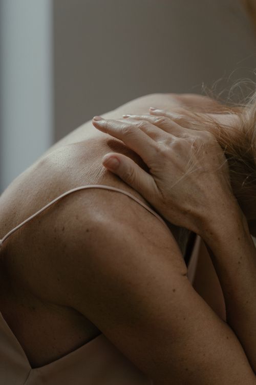 Free A serene and intimate close-up of a person's back, showcasing natural skin features. Stock Photo