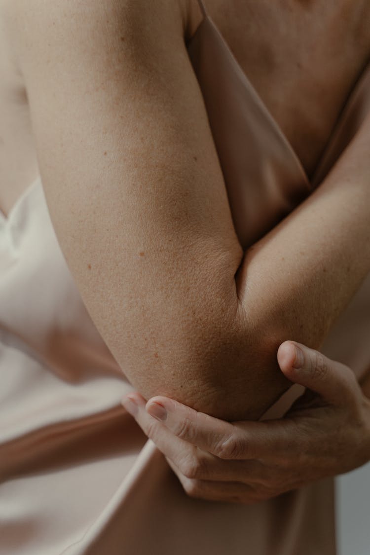 A Woman Touching Her Elbow