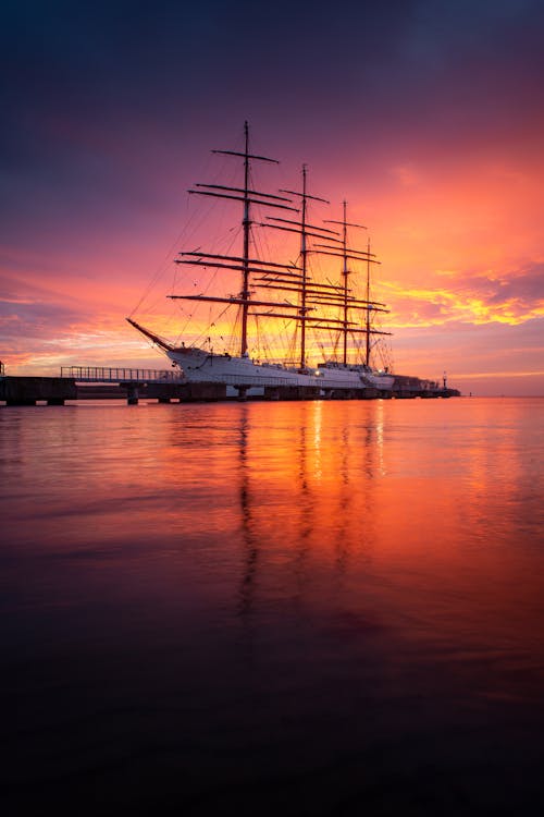 Ship in Water on Pink Sunset