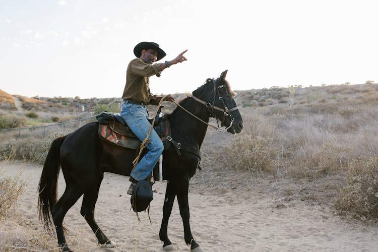 A Cowboy Riding A Horse 