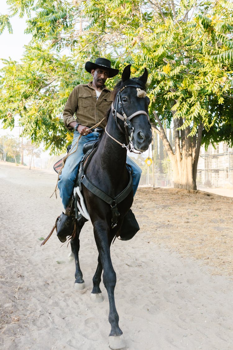 A Man Riding A Horse