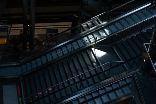 Stairs Between Escalators in Dark