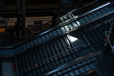 Empty escalators inside a modern railway station. Photo by Dennis Wolfram on Pexels