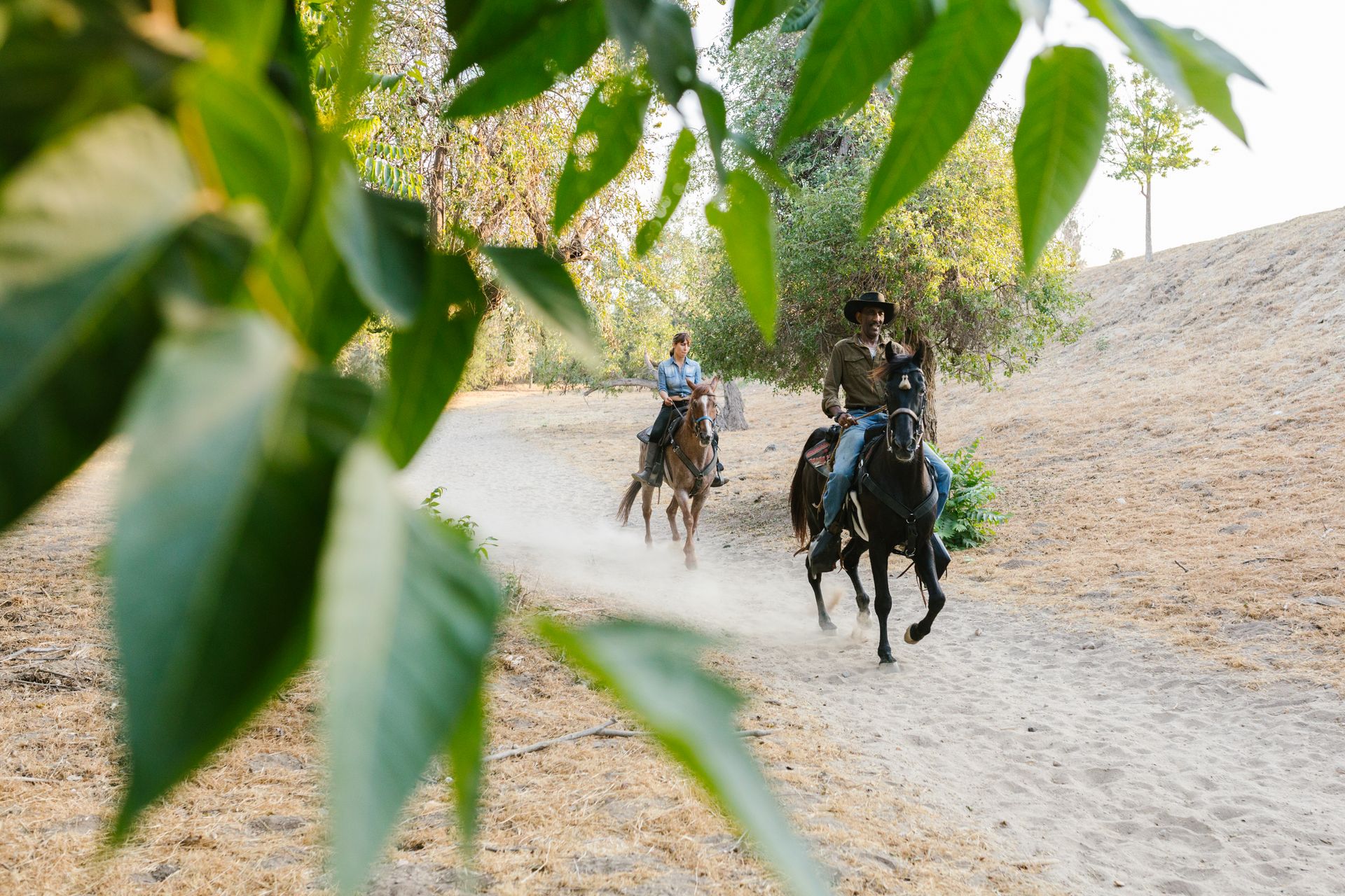 A Man and a Woman Riding a Horse