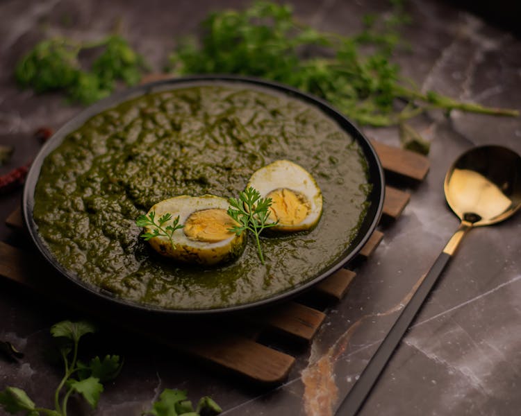 Green Masala Egg Curry Dish In Bowl