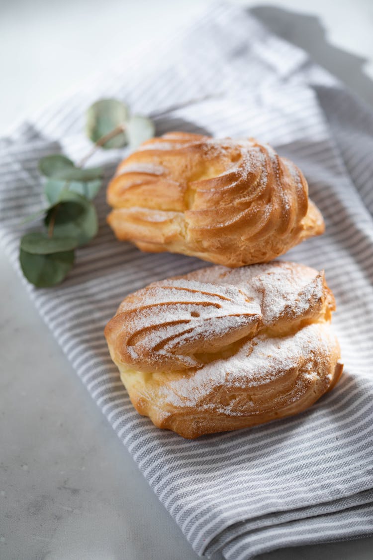 Fresh Pastries Lying On Tablecloth