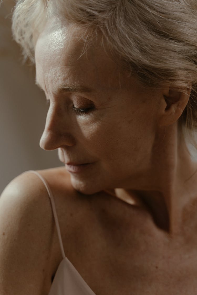 
A Close-Up Shot Of A Woman In A Nightgown