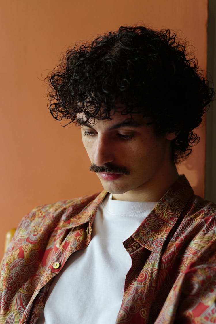 Man With Mustache And Curly Black Hair