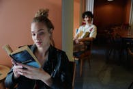 A Woman in Black Leather Jacket Holding a Book