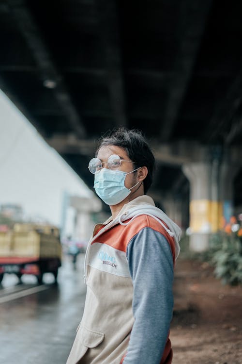 A Man Wearing Eyeglasses and Face Mask 