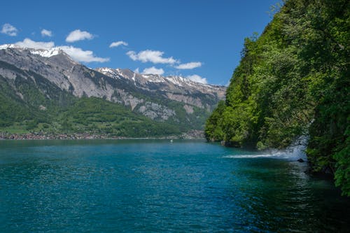 Snowcapped Mountains by the Lake Thun in Switzerland