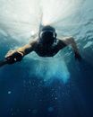 Man in Black Swimming Goggles Under Water