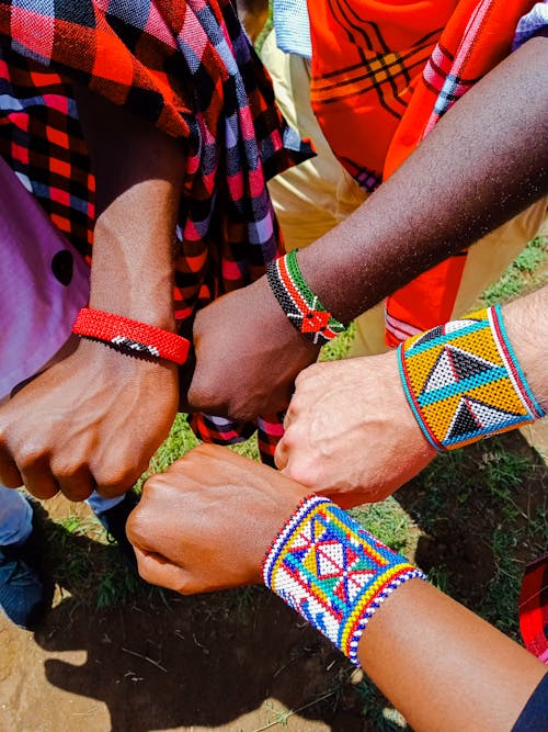 Hands with Colorful Traditional Beads Bracelets