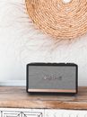 Black and Gray Sony Portable Speaker on Brown Wooden Table