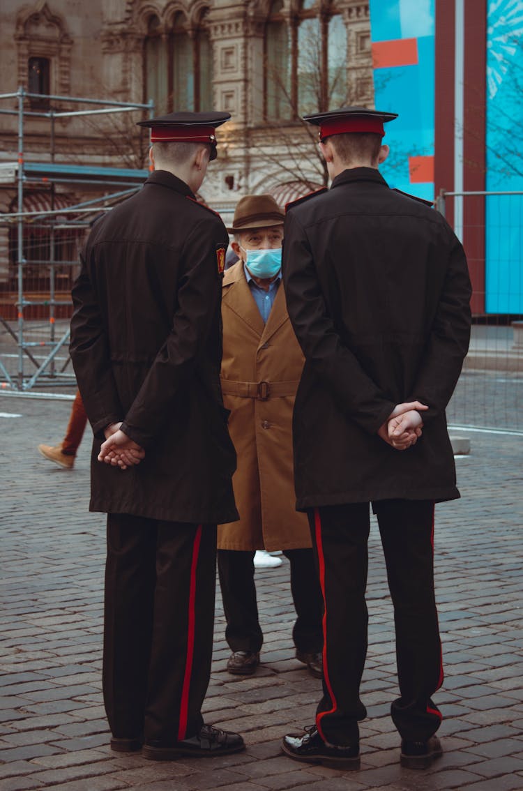 Old Man Talking With Police Officers On Street