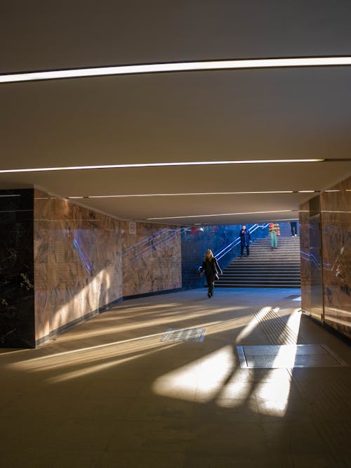 People Walking in Underground Walkway 