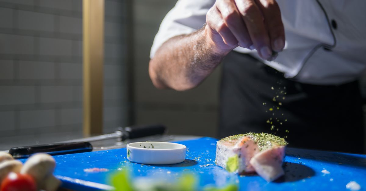 Chefs Using Spices Chef putting Spices on a Meat · Free Stock Photo