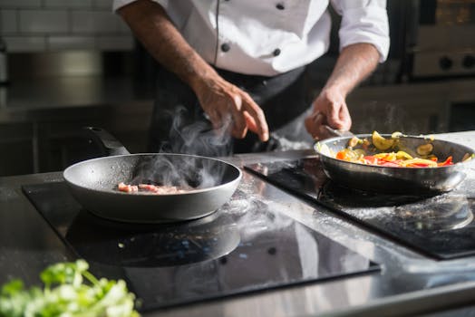 A chef skillfully prepares a meal with fresh ingredients on an electric stove, emphasizing culinary expertise.