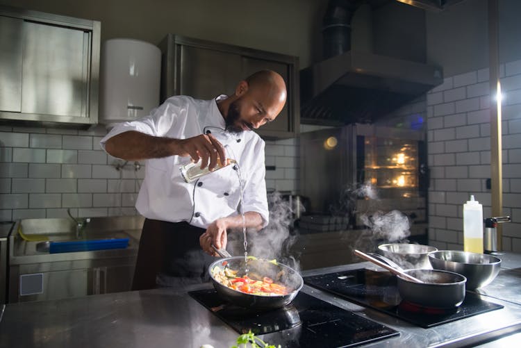 A Chef Cooking In The Kitchen