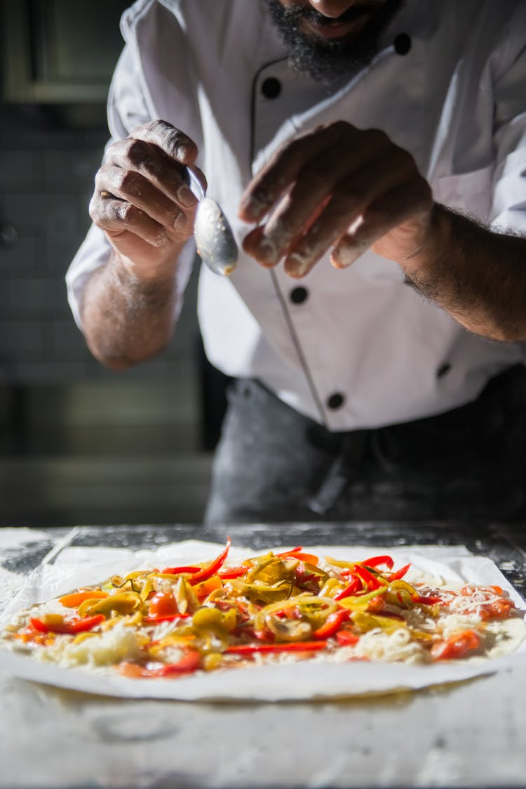 A Chef Preparing Pizza 