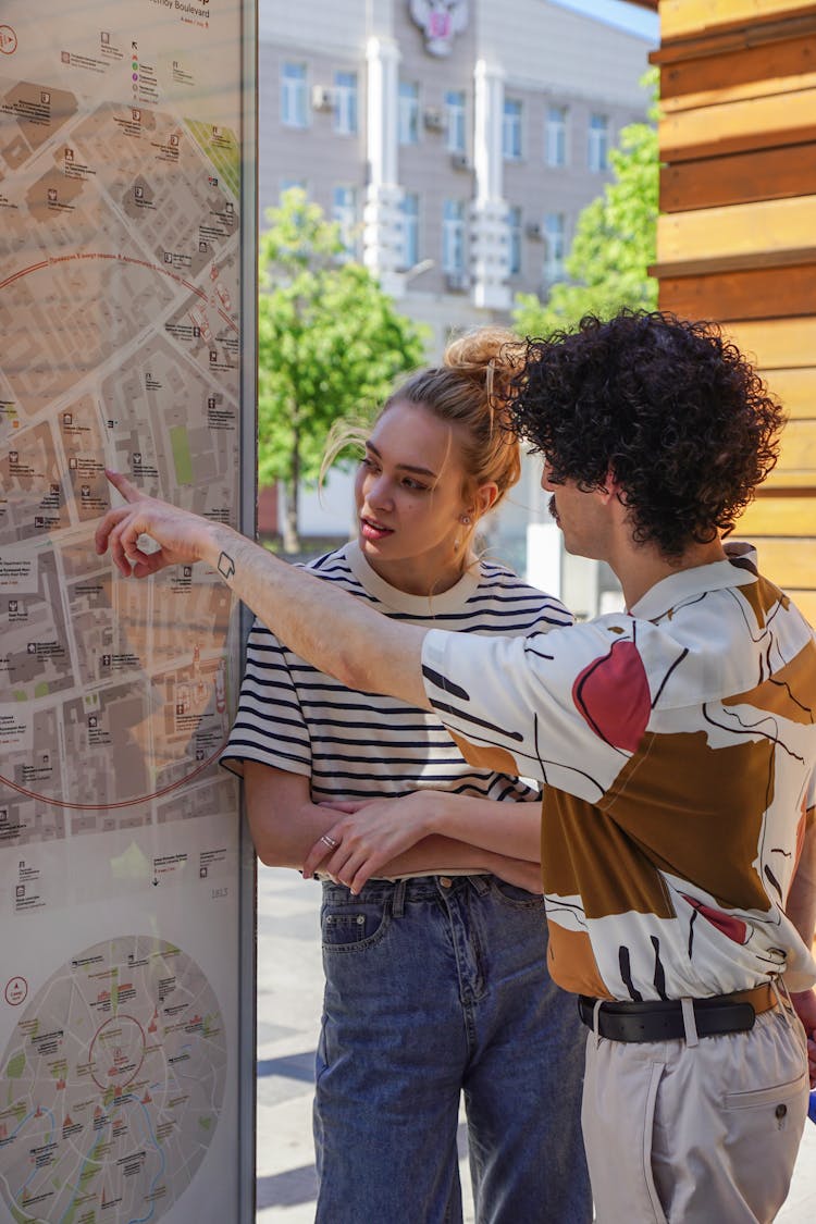 
A Couple Looking At A Map