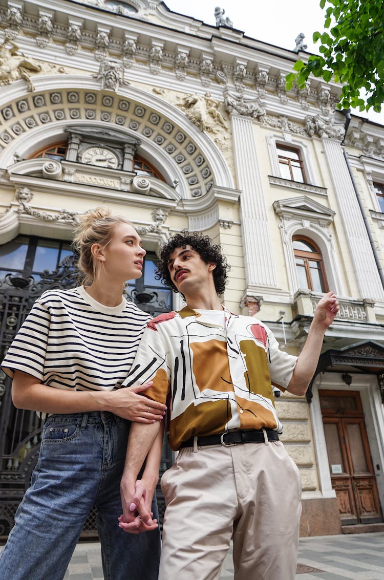 Man And Woman Standing Near Building