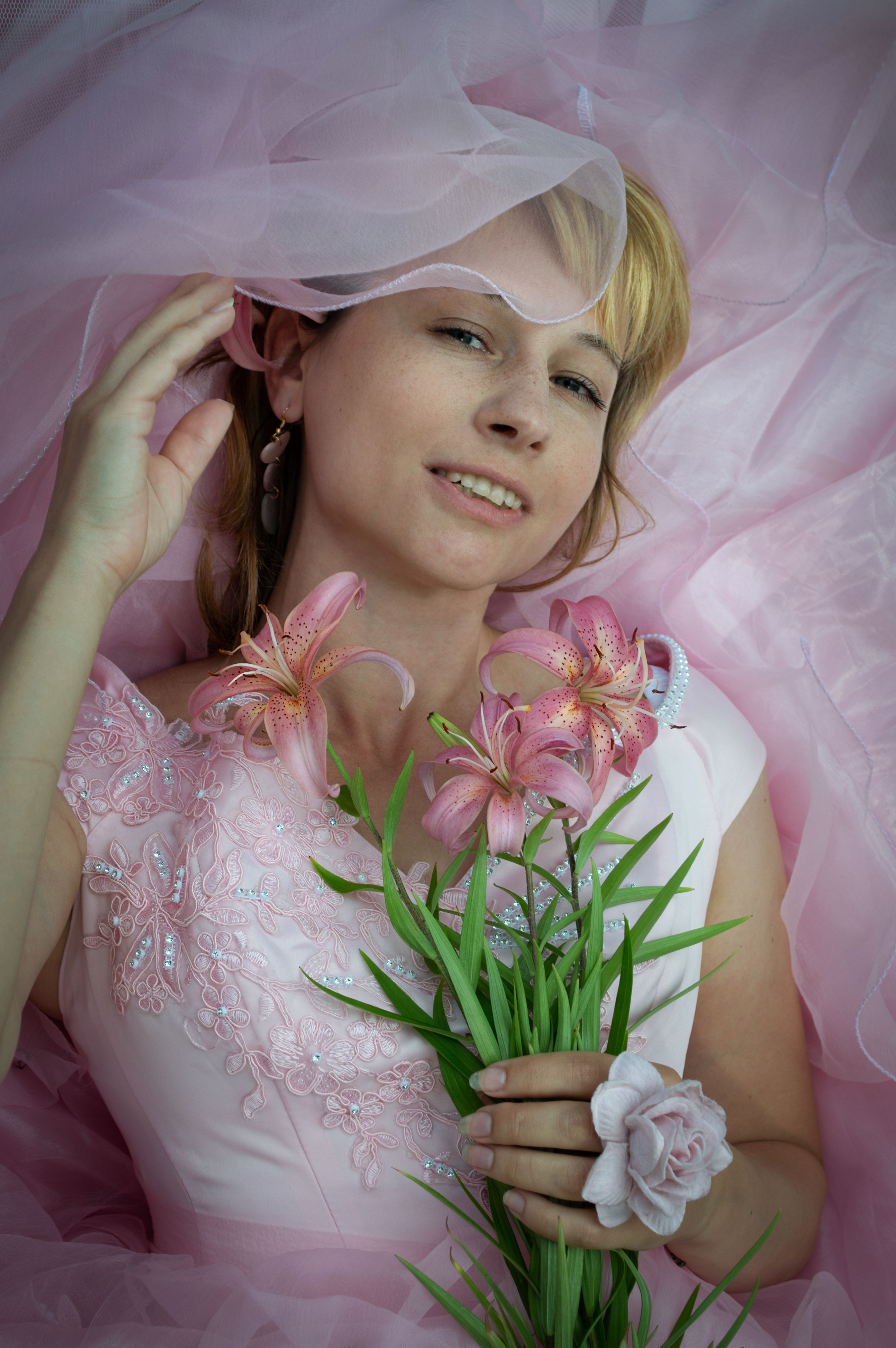 A Pretty Woman in Pink Dress Holding Pink Flowers · Free Stock Photo