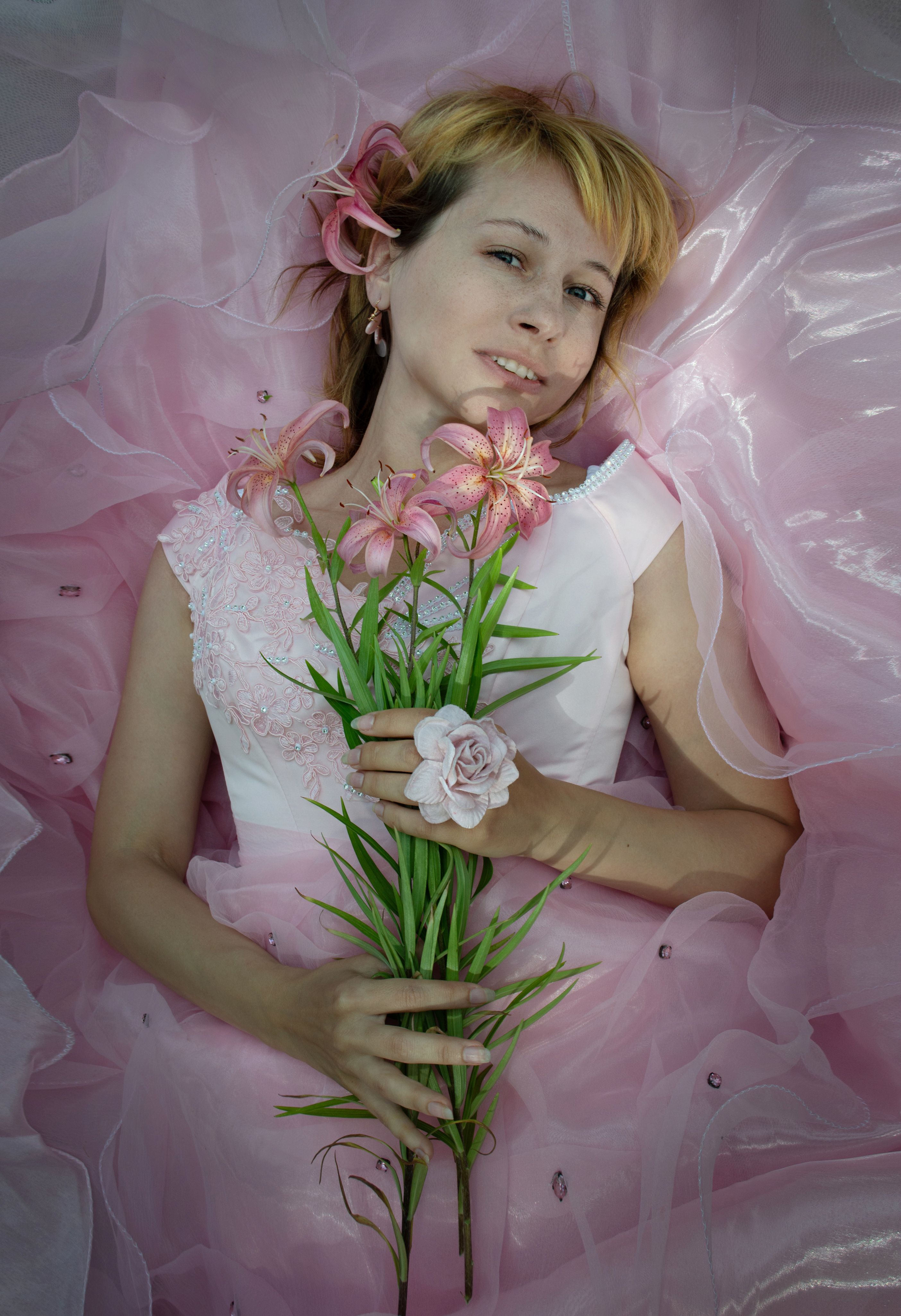A Pretty Woman in Pink Dress Holding Pink Flowers · Free Stock Photo